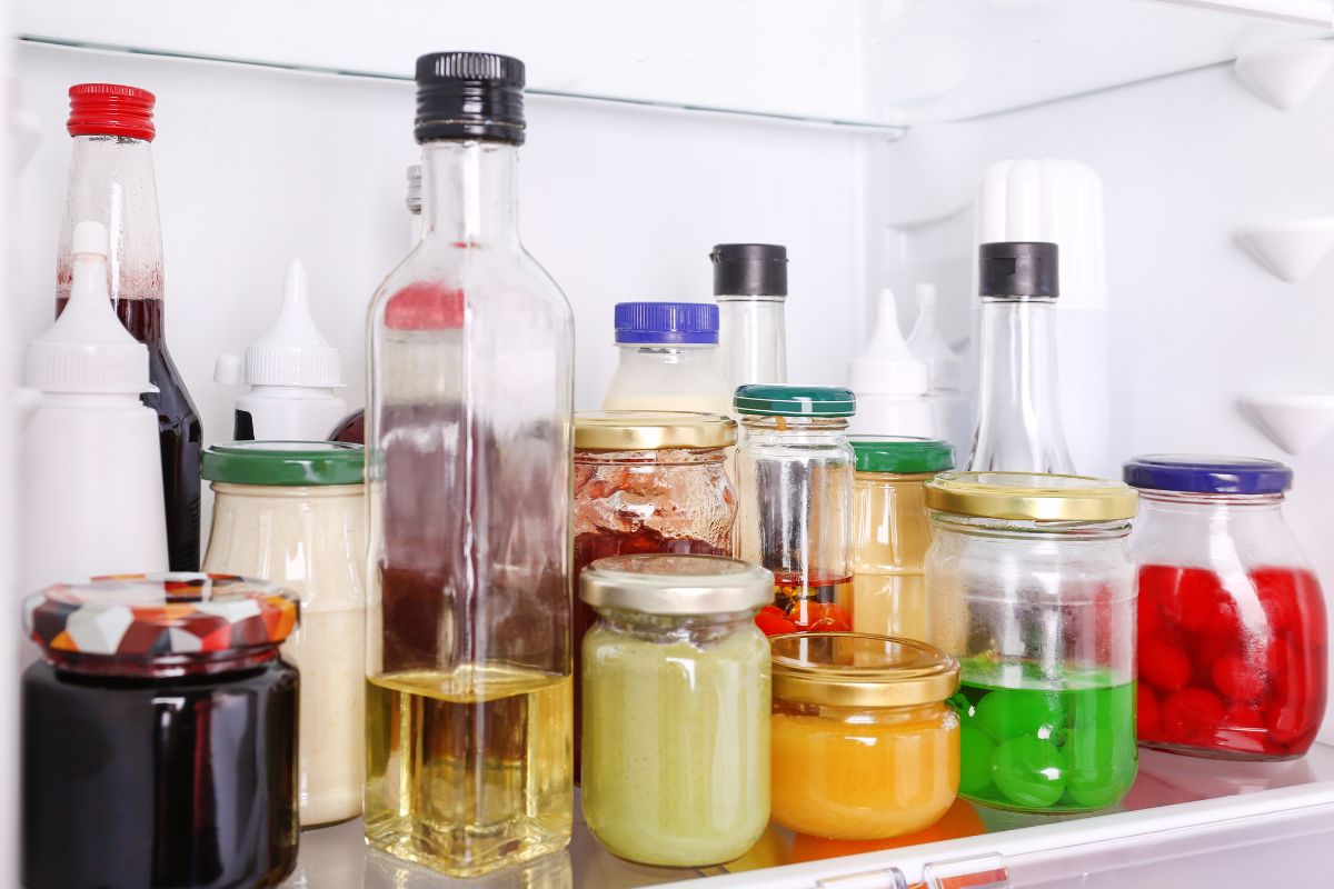 Jam and condiments in a fridge