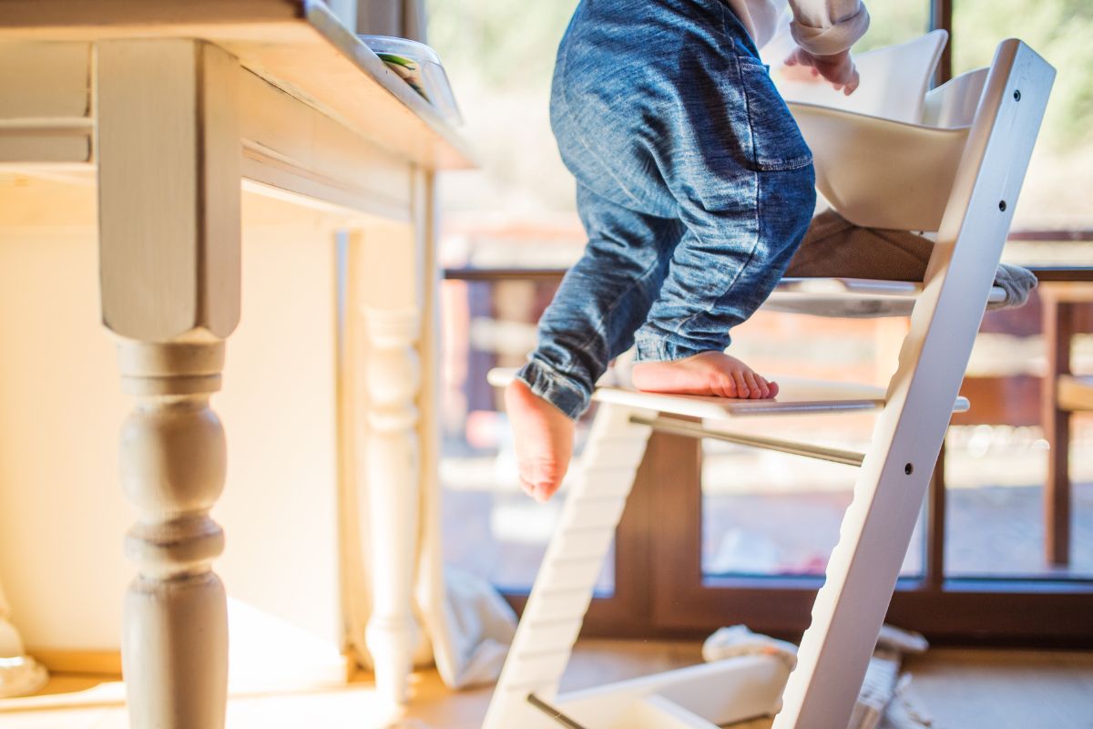 Baby walking up Tripp Trapp highchair